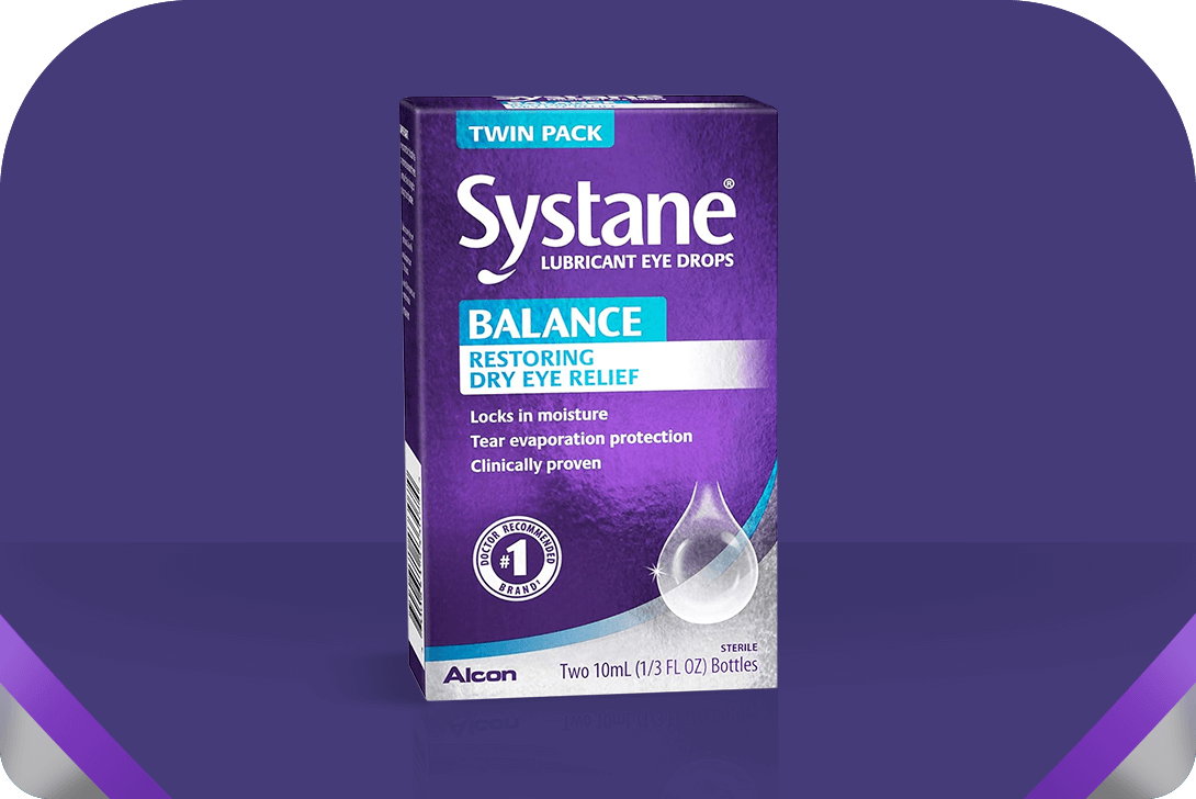 Image of a Systane lubricant eye drops box with a purple and white design. The box displays Balance Restoring Dry Eye Relief, highlighting moisture-locking and tear evaporation protection features. It contains two 10mL bottles.