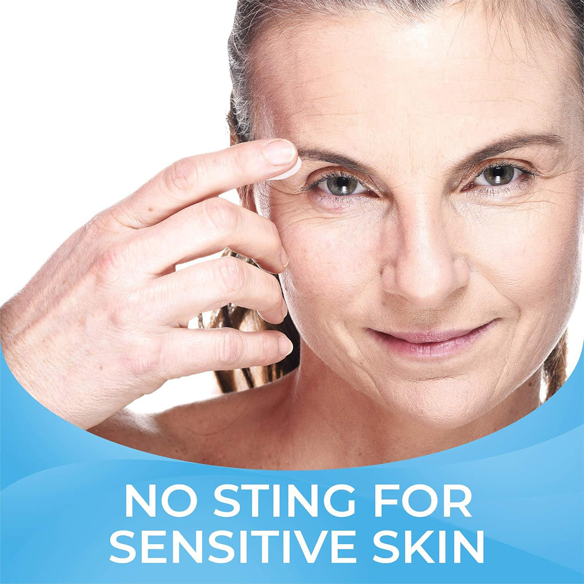 A person gently touches their eyebrow while smiling. The text at the bottom says No Sting for Sensitive Skin on a light blue background, showcasing Cliradex Light Foam by PRN with tea tree oil for enhanced ocular hygiene.