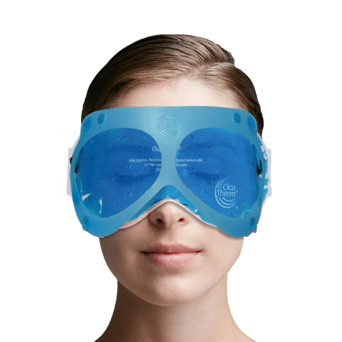 A person wears the OcuTherm Heat and Cold Gel Mask Eye Relief, covering their eyes and upper face with hair pulled back. The mask offers soothing thermal therapy. Against a plain white background, the focus is on this therapeutic eye relief product.