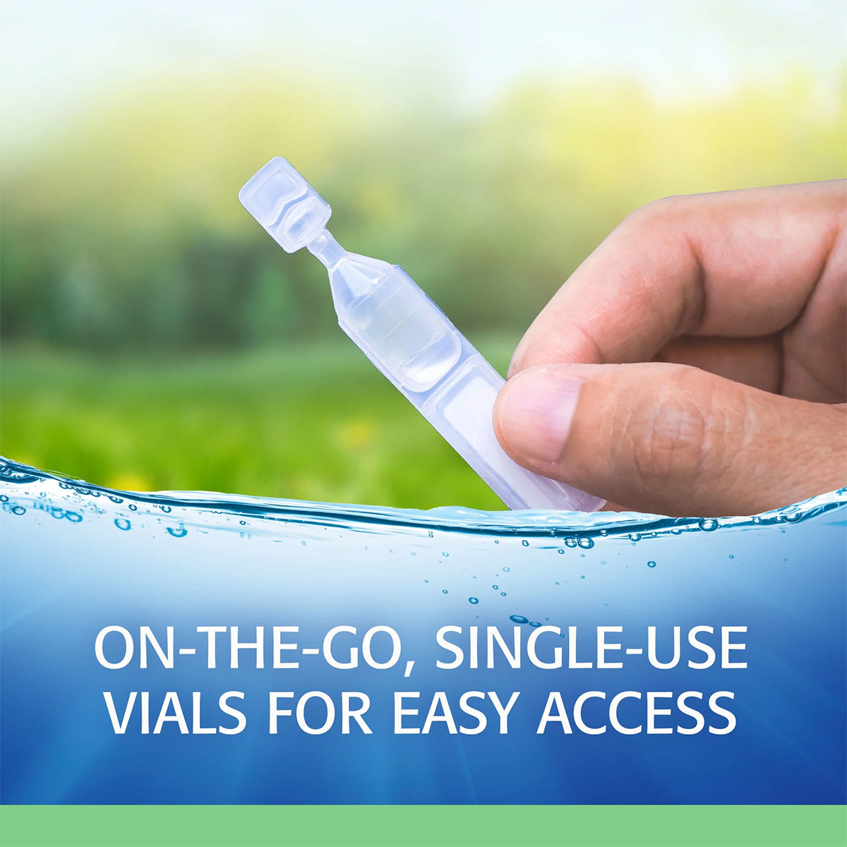 A hand holds a clear Refresh Plus Lubricant Preservative Free Eye Drop vial by Abbvie against a blurred natural background, featuring a wave design in green and blue. Text reads, On-the-go, preservative-free vials providing dry eyes relief for easy access.