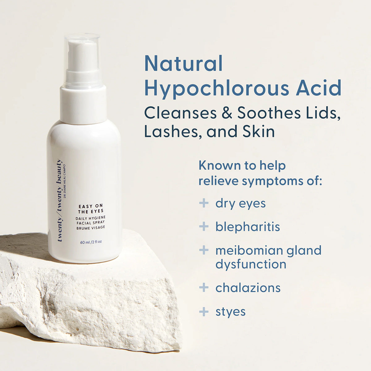 A white spray bottle labeled Easy on the Eyes sits on a stone slab. Beside it, text reads: Natural Hypochlorous Acid Cleanses & Soothes Lids, Lashes, and Skin. Promoting eye health and relieving dry eyes and blepharitis symptoms, this comes as part of the Twenty Twenty Soothing Eye Duo combo.