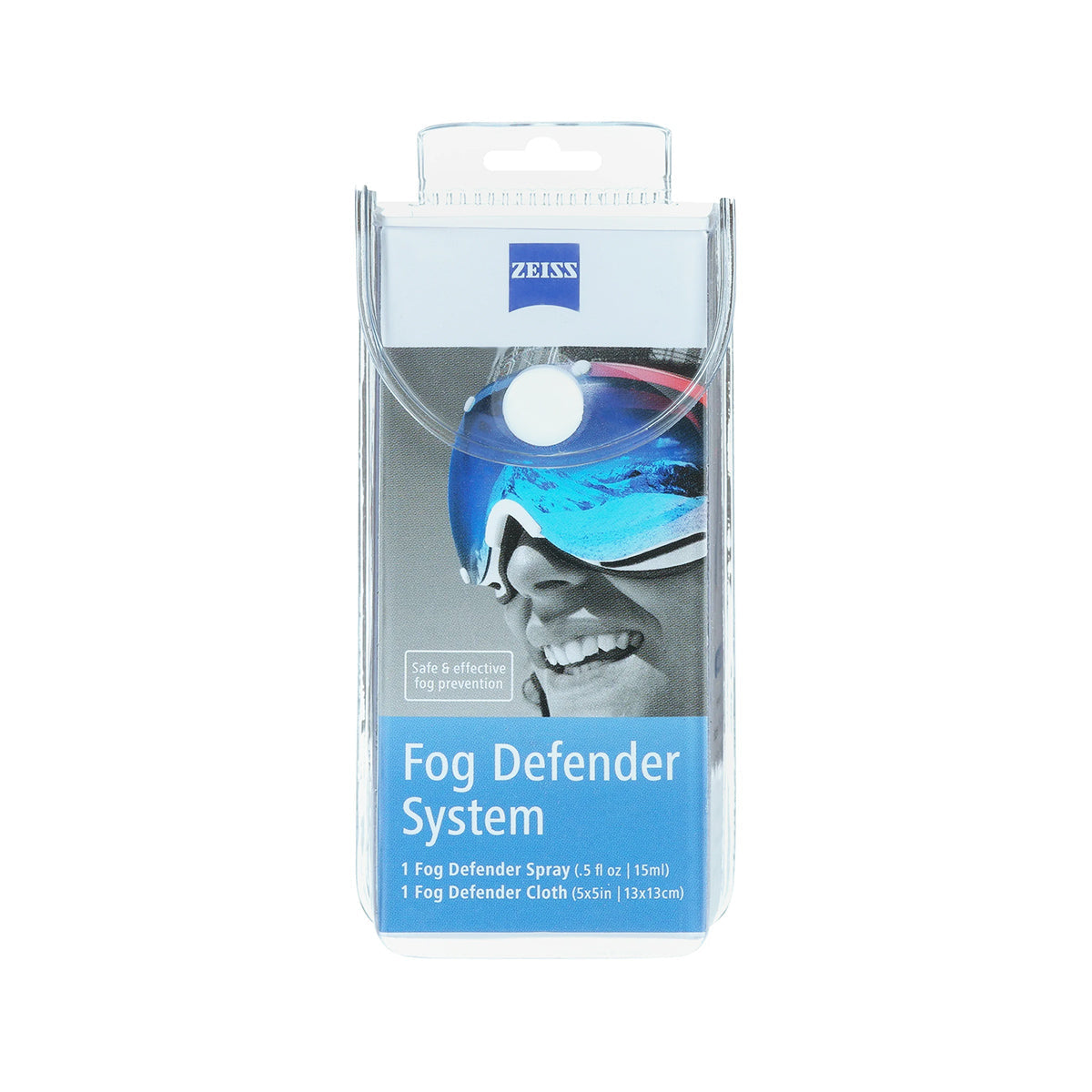The ZEISS Fog Defender System Anti-Fog Spray packaging displays a person with goggles. It includes a 15ml anti-fog spray and a microfiber cloth, highlighting its effectiveness for ZEISS lenses.