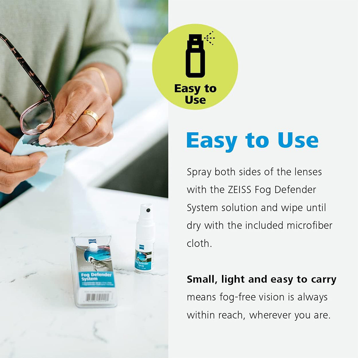 Someone gently cleans ZEISS lenses with the Zeiss Fog Defender System Anti-Fog Spray for Glasses and a microfiber cloth. Text reads: Simple application: spray both sides of lenses, then wipe with the included cloth. Compact, lightweight, and portable. Bottle and packaging shown.