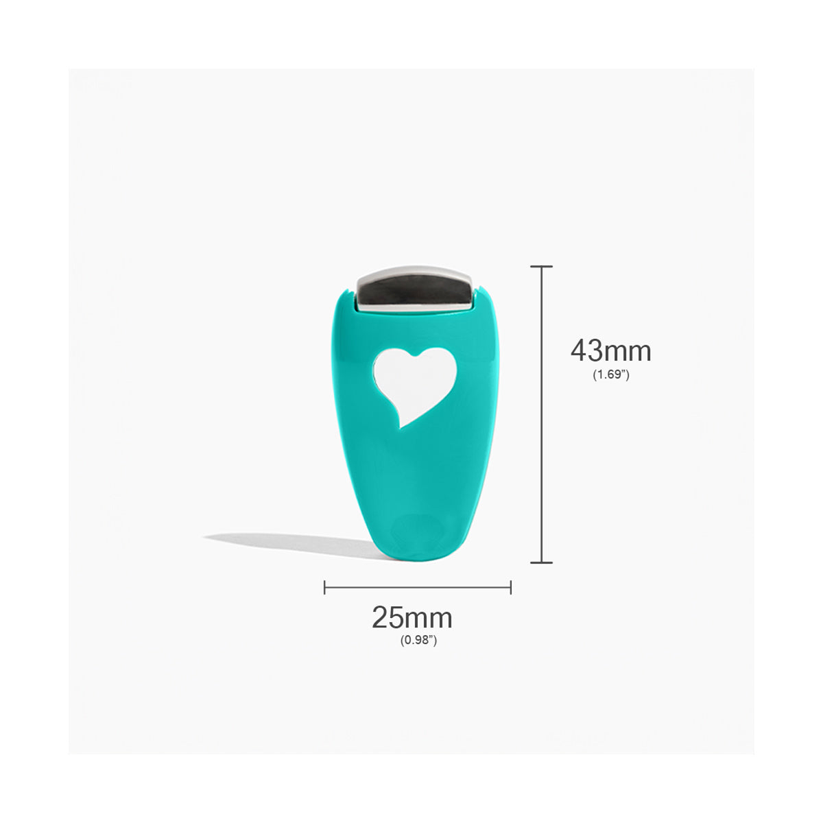 A small teal item with a heart-shaped cutout measures 25mm by 43mm. It features a stainless steel-like metallic top, casting a shadow to the left, from We Love Eyes Focused Eye Roll for toning, de-puffing, and relaxing tired eyes.