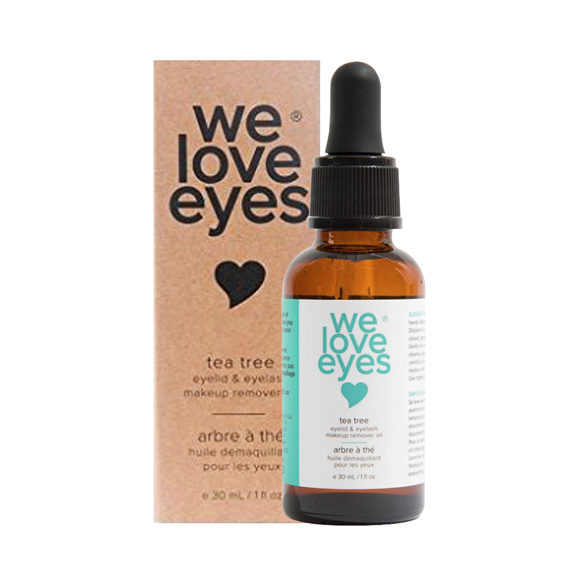 A brown glass bottle with a dropper labeled We Love Eyes - 100% All Natural Tea Tree Makeup Remover Oil rests beside its cardboard box. Labeled as an eyelid and eyelash makeup remover, it features Australian Tea Tree Oil and a charming heart graphic on the packaging.