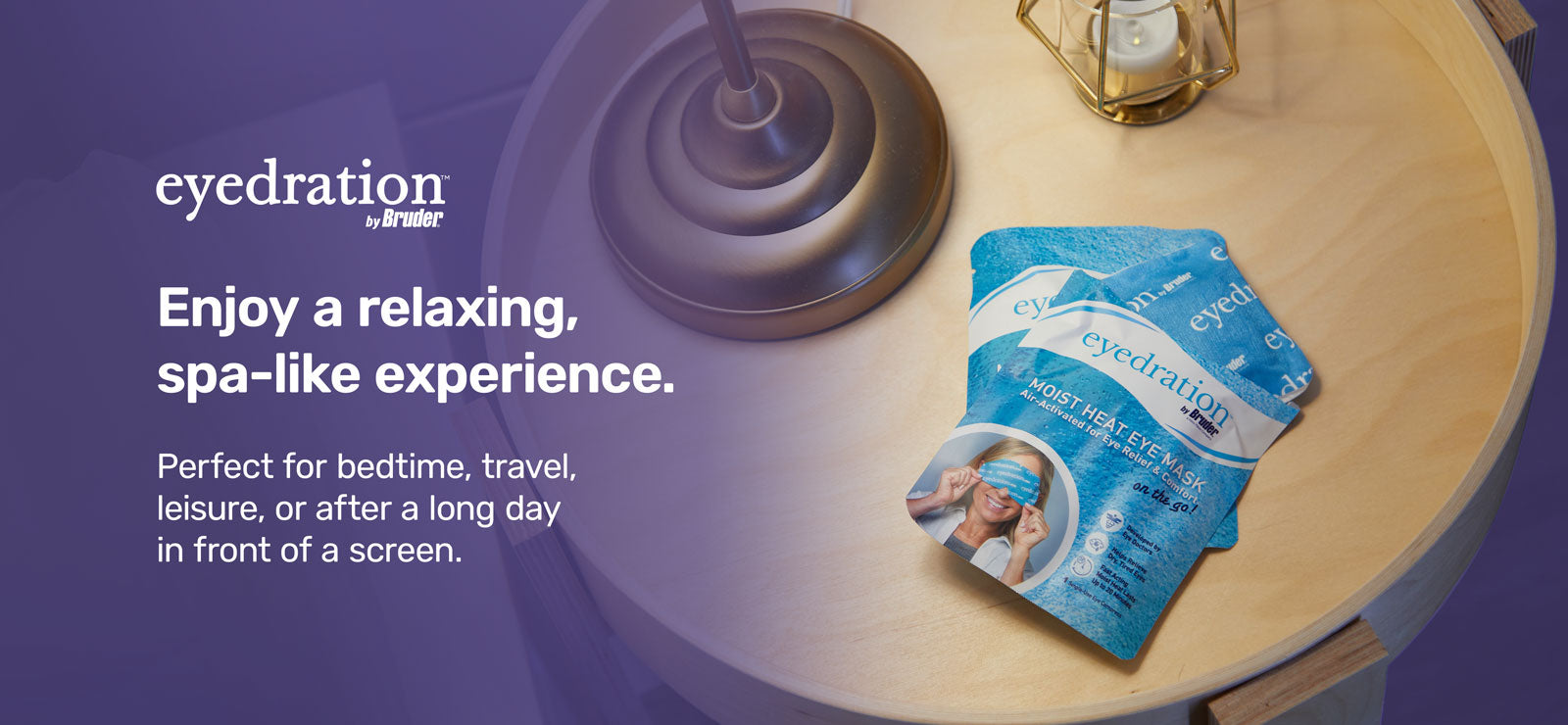 A packet of blue eye mask products labeled eyedration rests on a round wooden table with a purple surface. Nearby is a lit bulb hanging from above. Text reads: Enjoy a relaxing, spa-like experience. Perfect for bedtime, travel, leisure, or after a long day.
