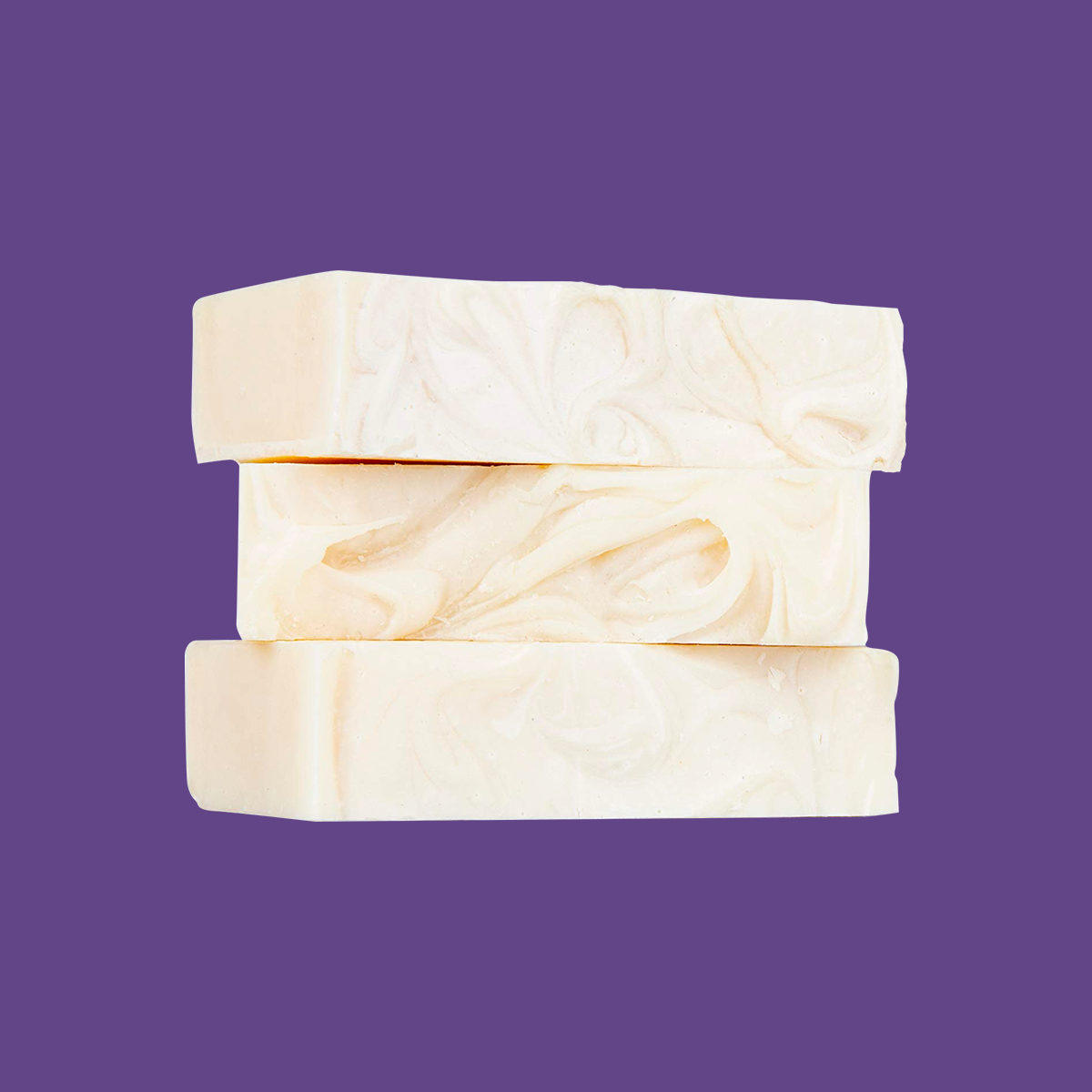 A single bar of Heyedrate Tea Tree Oil Face Soap and Eyelid Scrub by PRN - Physician Recommended Nutriceuticals, handcrafted with organic ingredients, displayed elegantly on a purple background.