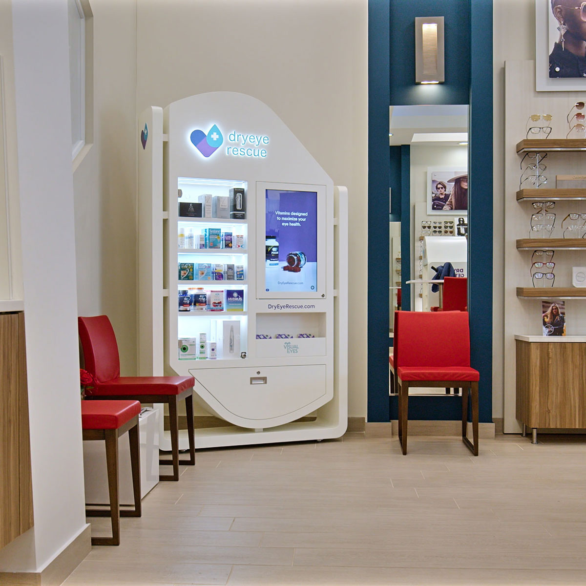 A modern eye care facility displays a Standing Floor Display with wheels (Hybrid) by DryEye Rescue, offering dry eye products and content on a sleek TV. Two red chairs and displayed eyeglasses decorate the space, while a neutral palette with bright lighting maintains its clean, organized look.