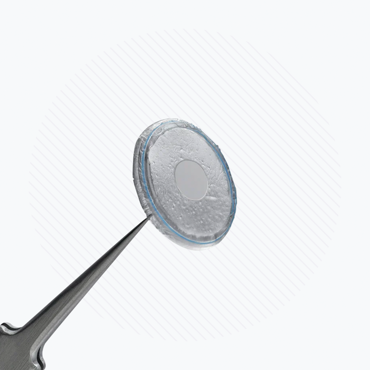 A pair of tweezers delicately grips a Prokera Amniotic Membrane by BioTissue, resembling a small contact lens or corneal bandage. The slightly textured surface with a faint circular pattern suggests its regenerative healing potential against a light background.