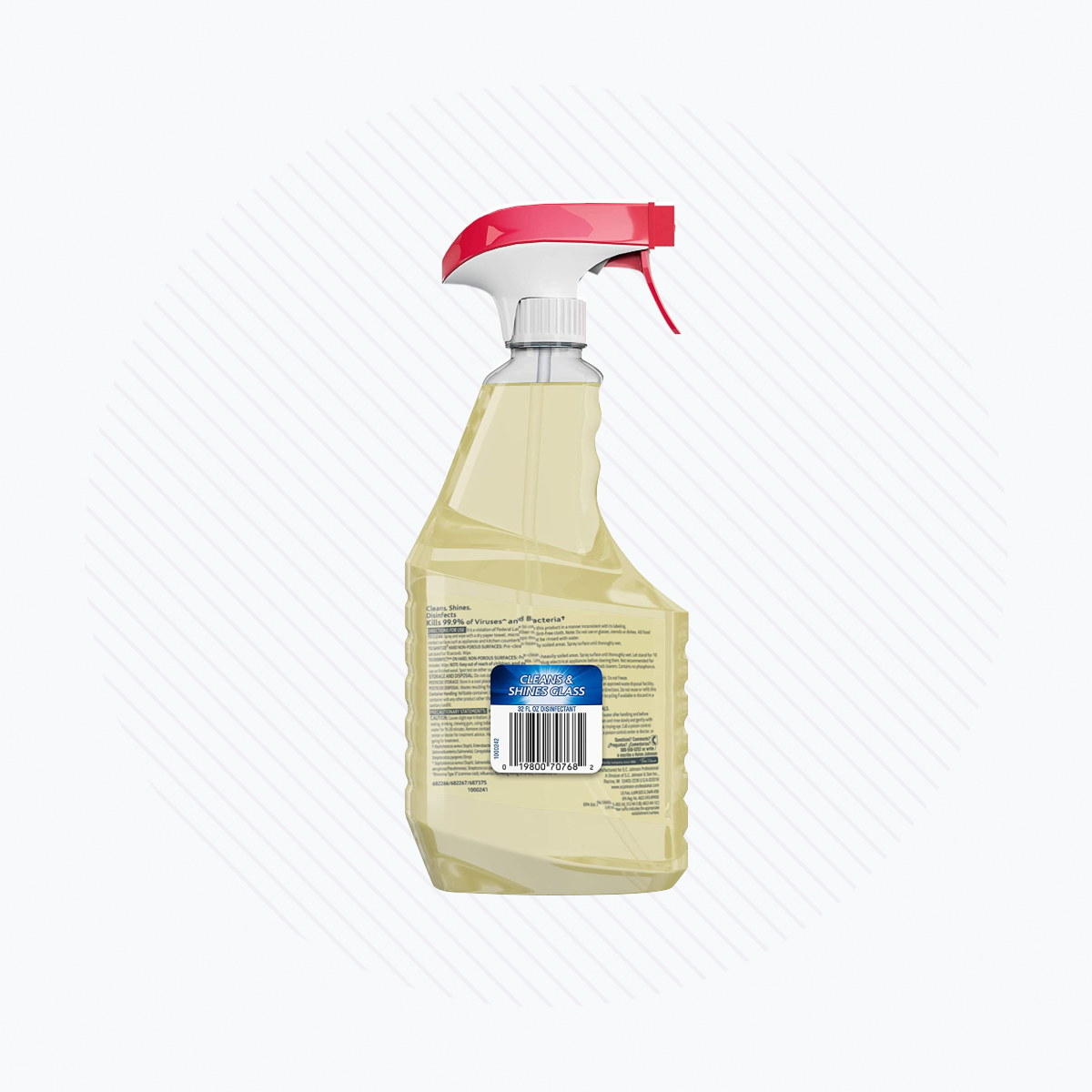 A clear plastic spray bottle with a red and white nozzle contains yellow liquid labeled SC Johnson Professional WINDEX Multi-Surface Disinfectant Cleaner, showcasing text and a barcode on one side, set against a subtle gray circular pattern.