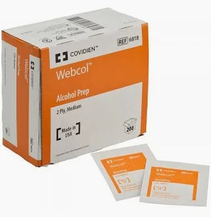 The product is a box of MedPharma USAs Covidien Alcohol Prep Pads, featuring orange and white packaging. Labeled 2 Ply, Medium, it contains 200 individually packed pads with 70% strength alcohol, made in the USA. Two packets are shown in the foreground.