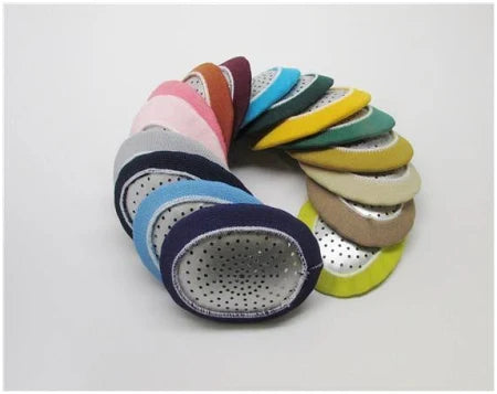 A spiral formation of multicolored, oval fabric patches with perforated holes resembles an artistic adult design. Including vibrant hues like pink, blue, green, yellow, and brown with a mesh texture akin to MedPharma USAs Eye Shield Fox Aluminum-Adult Colored Garter.