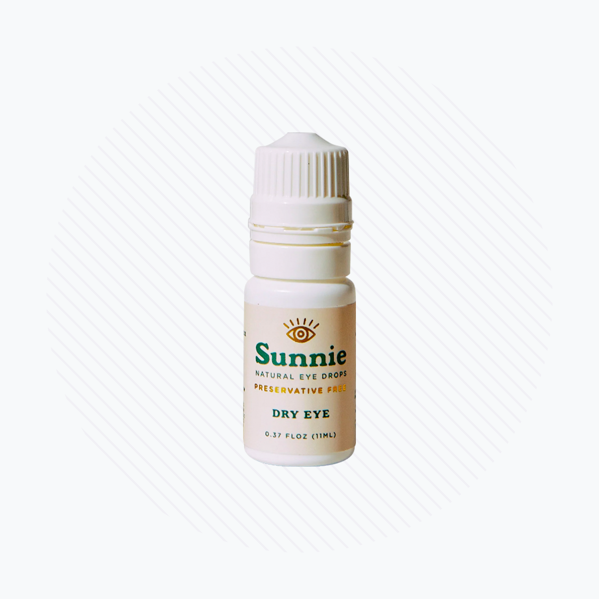A small white bottle labeled Natural Preservative Free Eye Drops for Dryness by Sunnie in green and yellow text, features a Natural Dryness Formula. It has a dropper cap and contains 11mL (0.37 fl oz) or 330+ drops. The background shows subtle diagonal lines on a light surface.