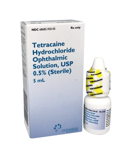 Box and bottle of Vision Rescue Pro Tetracaine, 0.5%, 5mL by Bausch + Lomb. The box stands upright with text and branding; the eye drops bottle featuring a yellow-striped cap is placed in front.