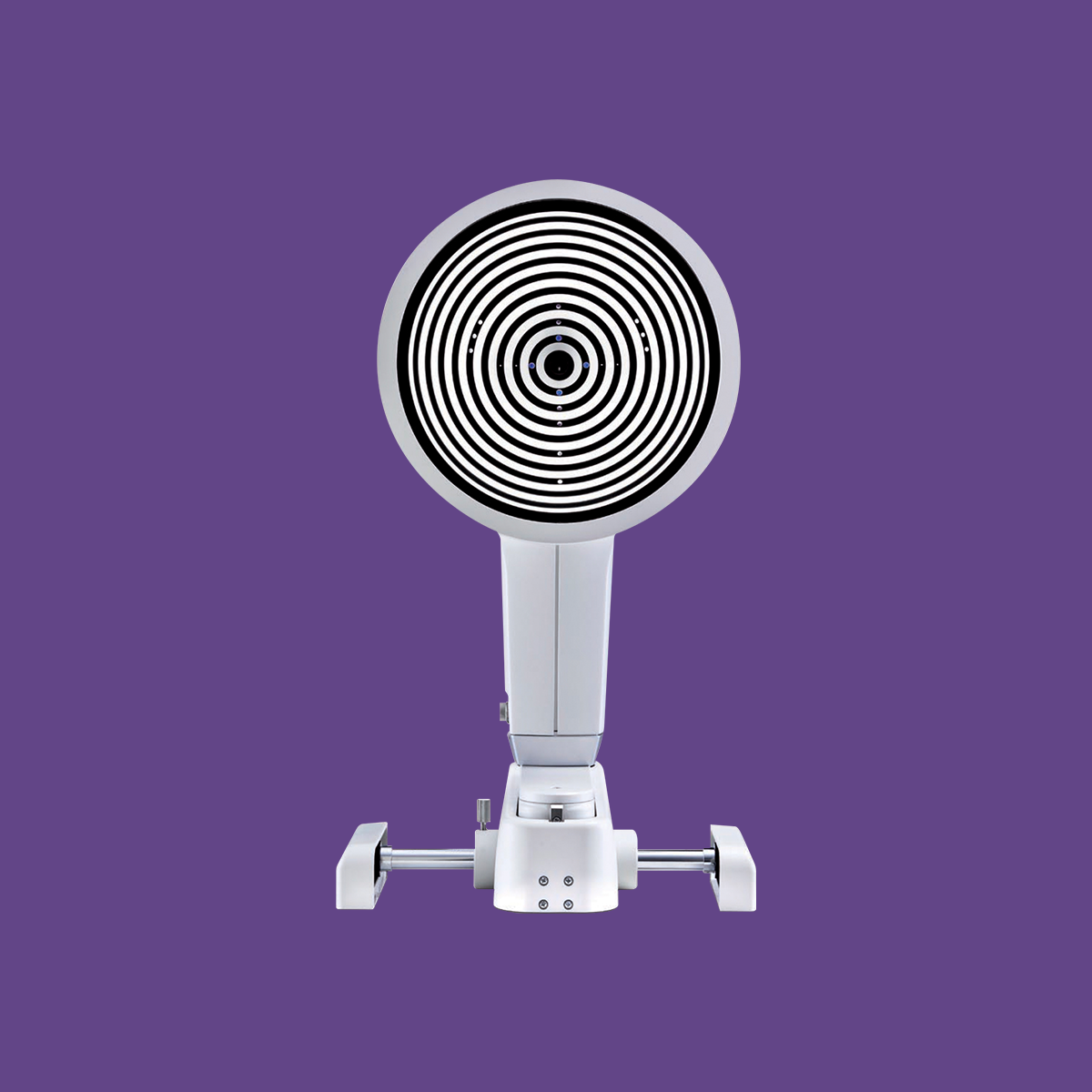 The OCULUS Keratograph® 5M by Oculus, a front-facing circular ophthalmology device, is set against a purple background. It features bullseye-like concentric rings and an adjustable stand for examining meibomian glands.