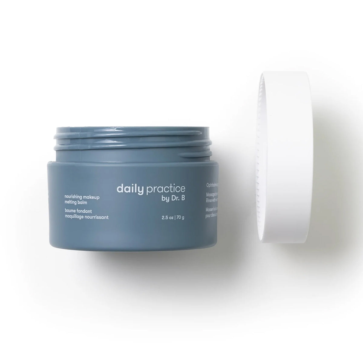 A gray jar from Daily Practice, titled Daily Practice Nourishing Makeup Melting Balm – Effortlessly Clean & Hydrate (70g), features soothing white text. The gentle balm removes makeup effortlessly, with a playfully tilted white lid, all set against a plain white backdrop.