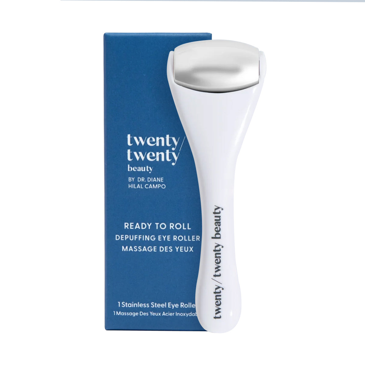 The Twenty Twenty Ready To Roll Depuffing Eye Roller, designed for sensitive eyes, is packaged in blue and includes the phrase 1 Stainless Steel Eye Roller in both English and French. Its metal-tipped white roller effectively reduces puffiness.