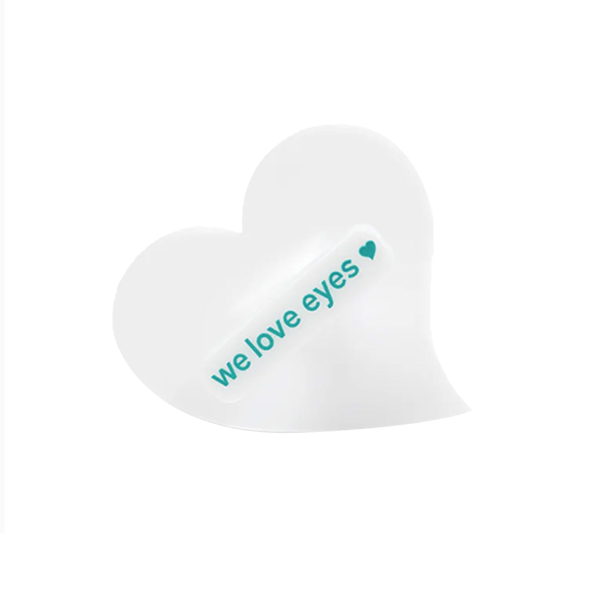 On a white background, the heart-shaped patch features teal text with we love eyes and a small heart icon, symbolizing gentle care. The We Love Eyes Mini Eyelid Scrub Mitt is perfect for precision cleansing and eyelid hygiene.