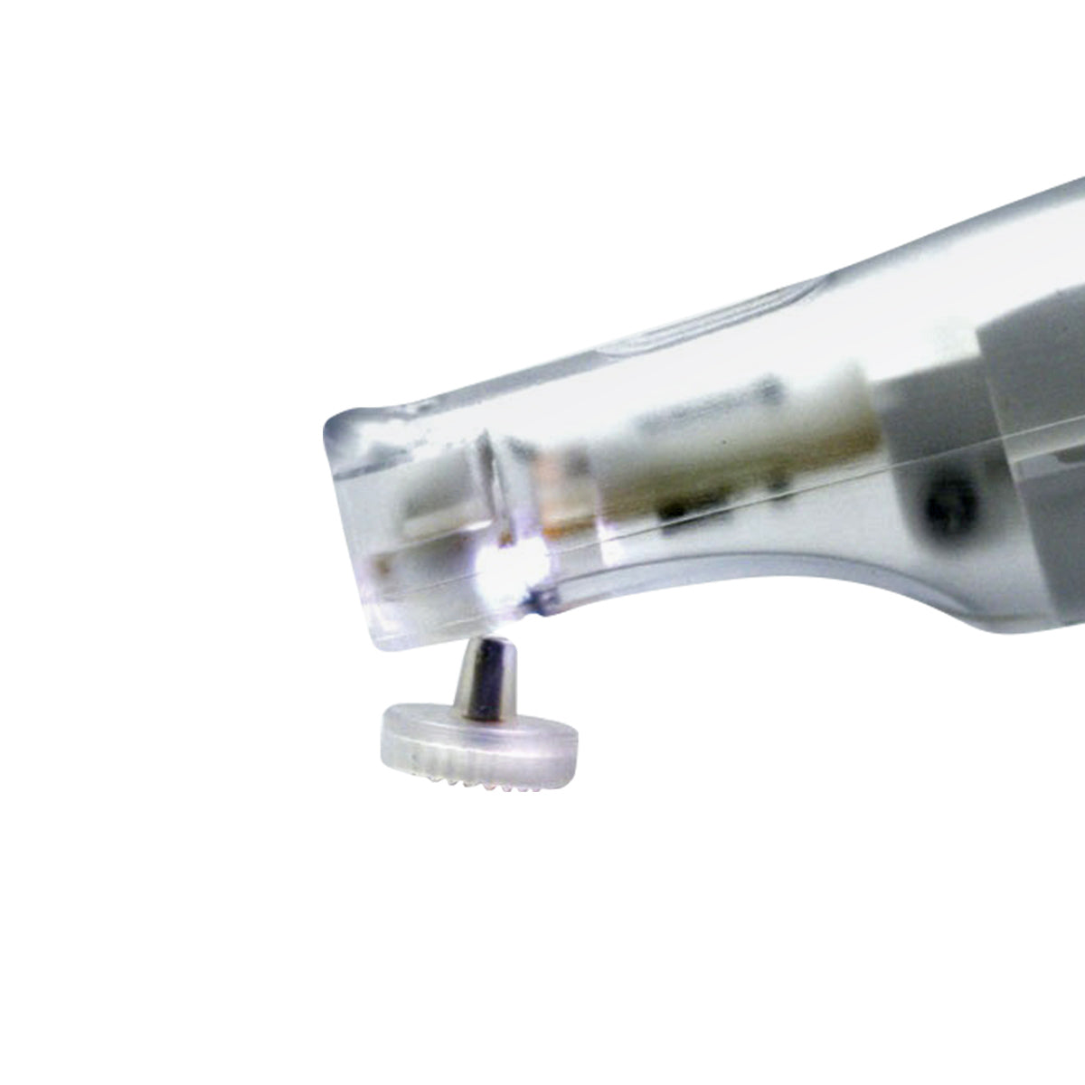 Close-up of a transparent mechanical pencil sharpener, revealing intricate gears and blade. Its clear casing resembles NuLids Replacement Tips by NuSight Medical, showcasing design and functionality with remarkable clarity.