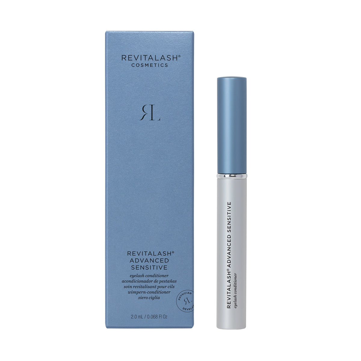 The RevitaLash Advanced Eyelash Conditioner and Enhancing Serum Sensitive (2.0mL 3 Mo.Supply) by RevitaLash comes in a sleek blue box with elegant white lettering. The slim white bottle, topped with a silver cap, features Revitasome Technology and rests elegantly next to its stylish packaging.