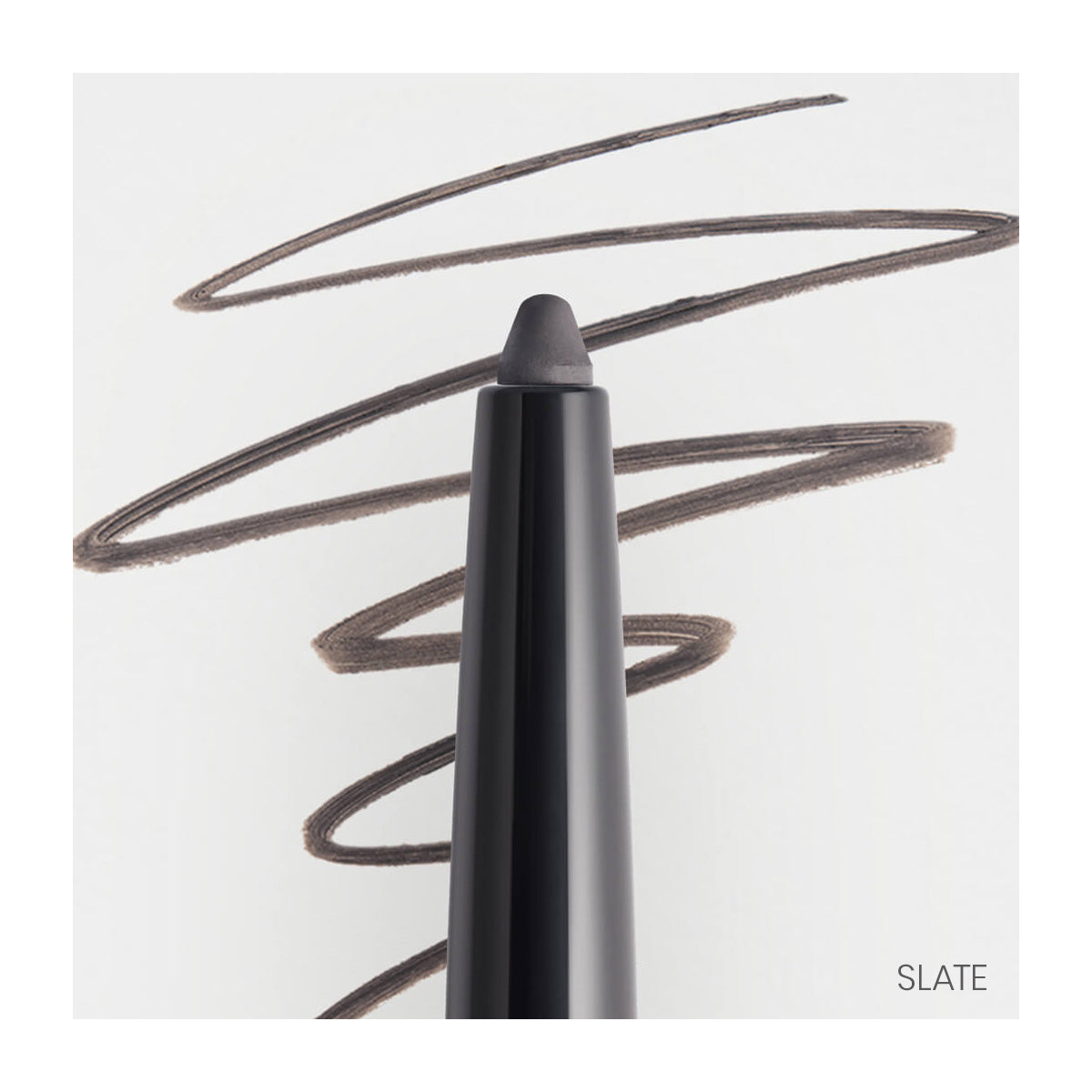 A RevitaLash Defining Liner Eyeliner, black with its tip exposed, rests on white paper; swirl-patterned black lines are drawn on it. Slate appears in the bottom right corner.