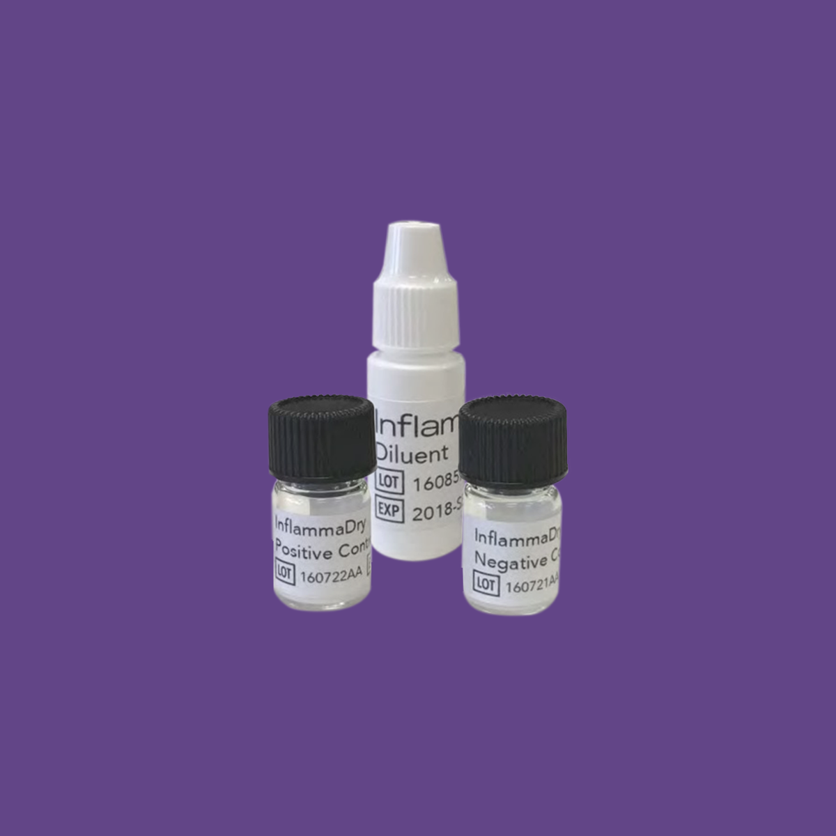 Three small bottles on a purple background include a spray bottle labeled Inflamma Diluent and two vials marked InflammaDay Positive Control and InflammaDay Negative Control. These are crucial for diagnosing dry eye by targeting the MMP-9 protein using Quidels Inflammadry technology.